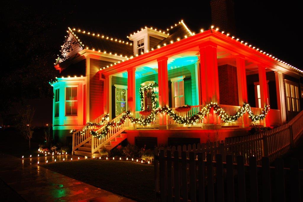 Outdoor landscape lighting installation highlighting a property after dark