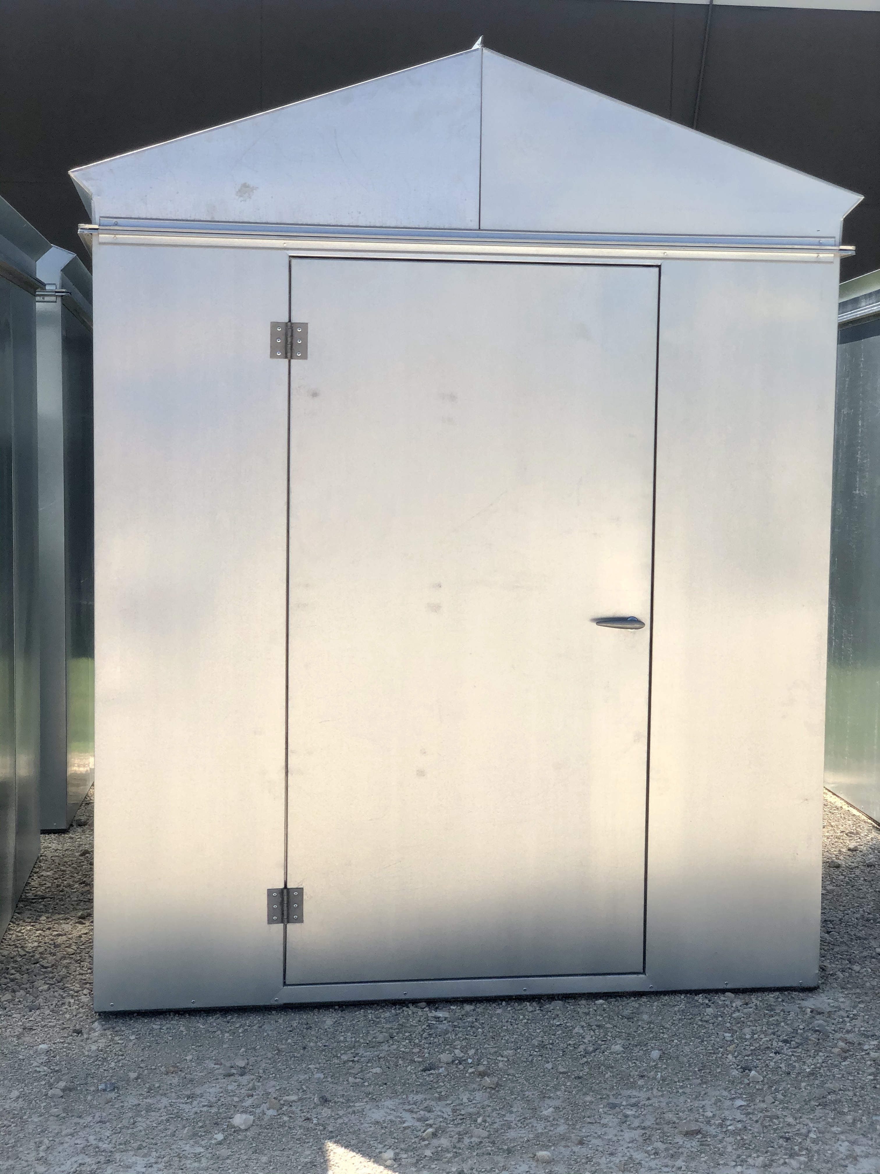 Insulated pump house with metal exterior
