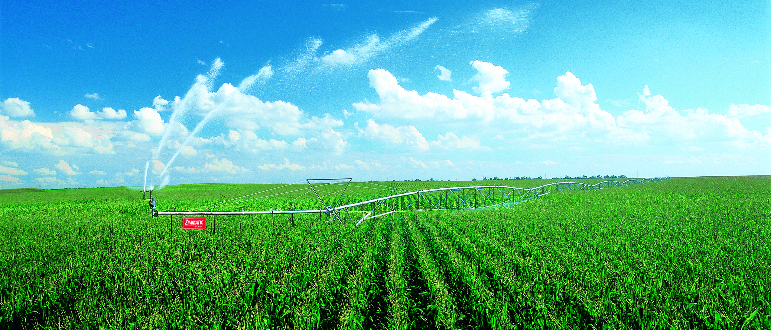 Zimmatic center pivot irrigation system in a mature corn field