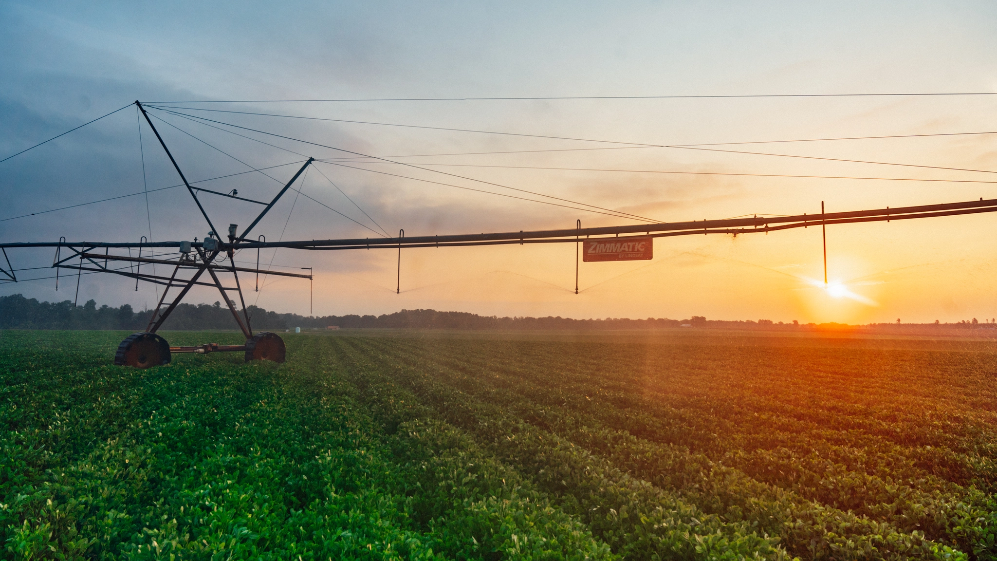 Zimmatic by Lindsay center pivot irrigation system at sunset